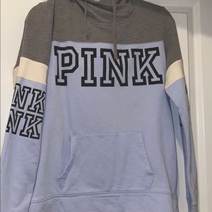 Gray and purple sweater.